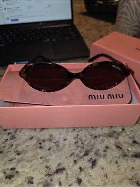 Miu Miu Brown Tortoiseshell Oval Sunglasses